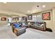 Finished basement featuring a sectional sofa, sports memorabilia, and a pool table for entertainment at 2885 W 115Th Dr, Denver, CO 80234