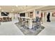 Basement bar featuring tile flooring, pendant lights, and comfortable seating at 2885 W 115Th Dr, Denver, CO 80234