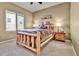Bedroom featuring a log-style bedframe and neutral carpet at 2885 W 115Th Dr, Denver, CO 80234