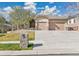 Charming single-story home featuring a two-car garage, stone accents, and manicured front yard at 2885 W 115Th Dr, Denver, CO 80234