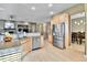 Open-concept kitchen with granite countertops and stainless steel appliances, flowing into the living area at 2885 W 115Th Dr, Denver, CO 80234