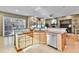 Kitchen area with bright cabinets, tile countertops, and stainless dishwasher at 2885 W 115Th Dr, Denver, CO 80234