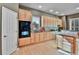 Bright kitchen with light wood cabinets and stainless appliances at 2885 W 115Th Dr, Denver, CO 80234