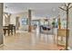 Open-concept living area featuring hardwood floors and neutral tones and a view to the dining and living rooms at 2885 W 115Th Dr, Denver, CO 80234