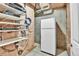 Unfinished basement storage space with shelving and a refrigerator for your organizational needs at 2885 W 115Th Dr, Denver, CO 80234