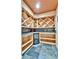 Custom-built wine cellar with ample storage racks and beverage cooler at 2885 W 115Th Dr, Denver, CO 80234