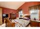 Vaulted ceiling bedroom with mirrored closet doors at 4582 Granby Way, Denver, CO 80239