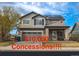 Charming two-story home featuring solar panels, a well-kept lawn and a two-car garage at 14873 E 119Th Ave, Commerce City, CO 80603