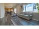 Inviting living room with a kitchen view, hardwood floors and a comfortable couch at 14873 E 119Th Ave, Commerce City, CO 80603