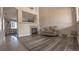 Living room with a fireplace, hardwood floors, and a comfortable couch at 14873 E 119Th Ave, Commerce City, CO 80603