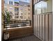 Cozy brick balcony with a view of the city, featuring a potted tree and metal railing at 2900 Inca St # 7, Denver, CO 80202