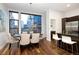 Bright dining room featuring a modern table and oversized windows at 2900 Inca St # 7, Denver, CO 80202