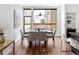 Bright modern dining area with large windows, stylish table and bar seating at 2900 Inca St # 7, Denver, CO 80202