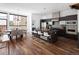 Open concept kitchen features stainless appliances, a large island with seating, and hardwood floors throughout at 2900 Inca St # 7, Denver, CO 80202