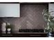 Stylish backsplash, stainless steel gas range, modern cabinetry, and granite countertops enhance this kitchen space at 2900 Inca St # 7, Denver, CO 80202