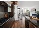 Modern kitchen boasts sleek, dark cabinetry and stainless steel appliances at 2900 Inca St # 7, Denver, CO 80202