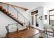 Bright living room with hardwood floors, modern staircase, and comfortable seating area with large windows at 2900 Inca St # 7, Denver, CO 80202