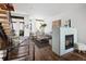 Open concept living area with modern fireplace and staircase at 2900 Inca St # 7, Denver, CO 80202