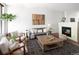 Bright living room has fireplace, comfortable seating, and modern decor at 2900 Inca St # 7, Denver, CO 80202