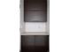 Efficient pantry with dark cabinets and modern hardware to maximize storage at 2900 Inca St # 7, Denver, CO 80202