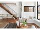 Bright sitting area has modern furnishings, large windows, and staircase at 2900 Inca St # 7, Denver, CO 80202