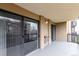 Spacious, covered balcony with sliding glass doors, and space for an outdoor seating area at 14050 E Linvale Pl # 309, Aurora, CO 80014