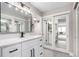 Updated bathroom featuring a modern vanity, sleek fixtures, and contemporary finishes at 14050 E Linvale Pl # 309, Aurora, CO 80014