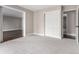 Bedroom with neutral walls, neutral carpet, and doorways to other rooms in the home at 14050 E Linvale Pl # 309, Aurora, CO 80014