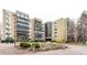 Landscaped exterior showcasing the building's architectural design, well-maintained grounds and greenery at 14050 E Linvale Pl # 309, Aurora, CO 80014