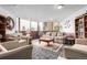 This charming lounge features comfortable seating, decorative accents, and bright windows for an inviting atmosphere at 14050 E Linvale Pl # 309, Aurora, CO 80014