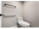 Neutral bathroom featuring a modern toilet with accessibility bars, and a neutral palette at 14050 E Linvale Pl # 309, Aurora, CO 80014