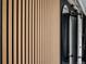 Stylish accent wall featuring wooden slats and black metal details at 3738 Black Feather Trl, Castle Rock, CO 80104