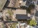 Aerial view of a backyard with lawn, trees and view of the house roof at 3738 Black Feather Trl, Castle Rock, CO 80104