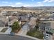 Aerial view of a home nestled in a community with scenic mountain views in the background at 3738 Black Feather Trl, Castle Rock, CO 80104