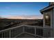 Relax on this backyard deck and enjoy panoramic views of the sunset over the distant city skyline at 3738 Black Feather Trl, Castle Rock, CO 80104