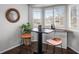 Charming dining area with bar, hardwood floors, plantation shutters and built-in cabinets at 3738 Black Feather Trl, Castle Rock, CO 80104
