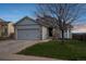 Charming home with a two-car garage, well-maintained lawn, and mature trees at 3738 Black Feather Trl, Castle Rock, CO 80104