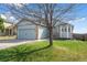 Charming home with a two car garage, well-maintained lawn and a beautiful tree in the front yard at 3738 Black Feather Trl, Castle Rock, CO 80104