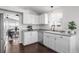 Bright kitchen featuring white cabinets, stainless steel appliances, and an adjacent dining area at 3738 Black Feather Trl, Castle Rock, CO 80104