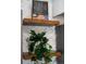 Close-up of kitchen shelves with plants and cookbook in a modern decorated home at 3738 Black Feather Trl, Castle Rock, CO 80104