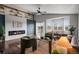 Modern living room boasts a sleek fireplace, bright windows, and comfortable seating for Gathering and guests at 3738 Black Feather Trl, Castle Rock, CO 80104
