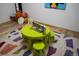 Fun playroom offers a whimsical atmosphere with colorful furniture, a playful rug, and charming decor at 3738 Black Feather Trl, Castle Rock, CO 80104
