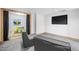Open recreation room with comfortable seating and access to a playroom at 3738 Black Feather Trl, Castle Rock, CO 80104