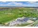 Scenic aerial shot of Common Ground Golf Course with lush fairways and clubhouse at 701 Emporia St, Aurora, CO 80010