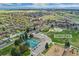 Aerial view of Fulton Park featuring courts, playground, green spaces, and neighborhood at 701 Emporia St, Aurora, CO 80010