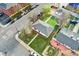 An elevated view shows the house, detached garage, lawn and neighborhood context at 701 Emporia St, Aurora, CO 80010