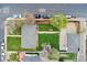 A high angle aerial shot of the property, including a lawn and detached garage at 701 Emporia St, Aurora, CO 80010