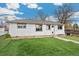 Charming home with a well-maintained yard and lovely landscaping, including a turf lawn at 701 Emporia St, Aurora, CO 80010