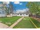 A serene backyard featuring a lush lawn and shed, perfect for outdoor activities at 701 Emporia St, Aurora, CO 80010
