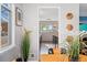 Cozy dining area featuring a view into the kitchen, lots of natural light, and decorative wall art at 701 Emporia St, Aurora, CO 80010